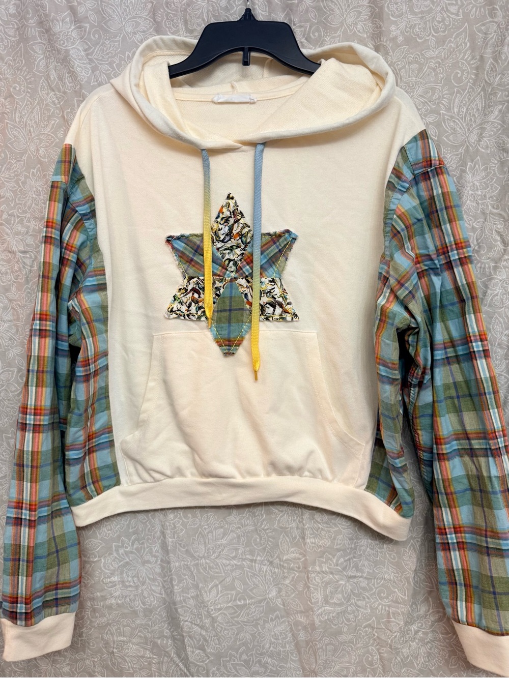 Elodie Cream Hoodie with Plaid Sleeves and Quilted Star Patch Accent